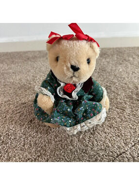 Vintage bear toy wearing a green dress stuffed animals